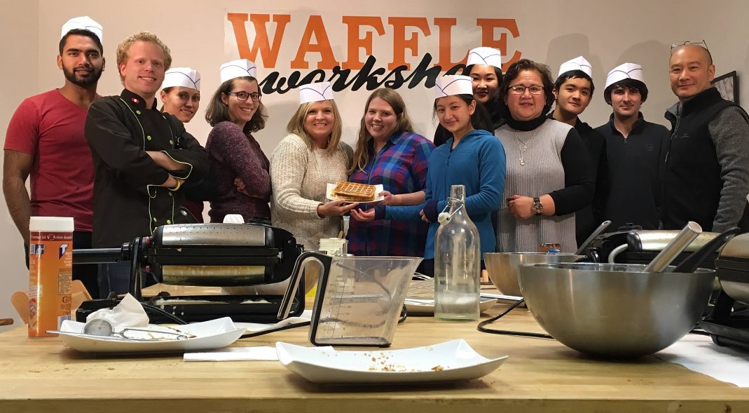 group people taking waffle making class